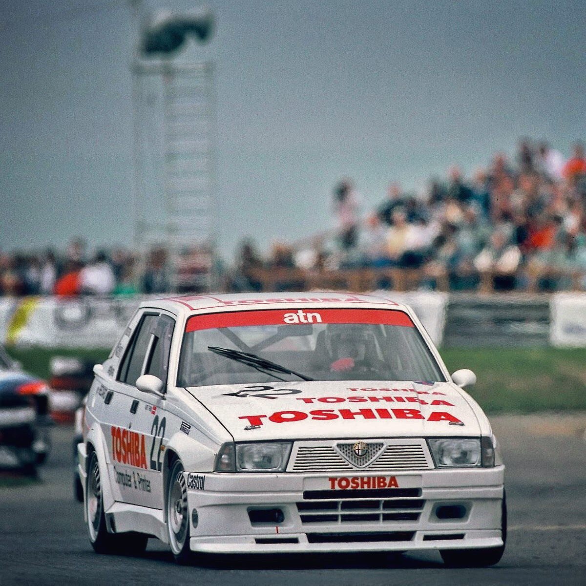 Kurt Thiim with the Alfa Romeo 75 Turbo Evoluzione at Mainz-Finthen, 5th round of the 1987 Deutsche Tourenwagen Meisterschaft. 

The Danish driver had clinched the title the year before with the Rover Vitesse but this campaign would prove a lot tough