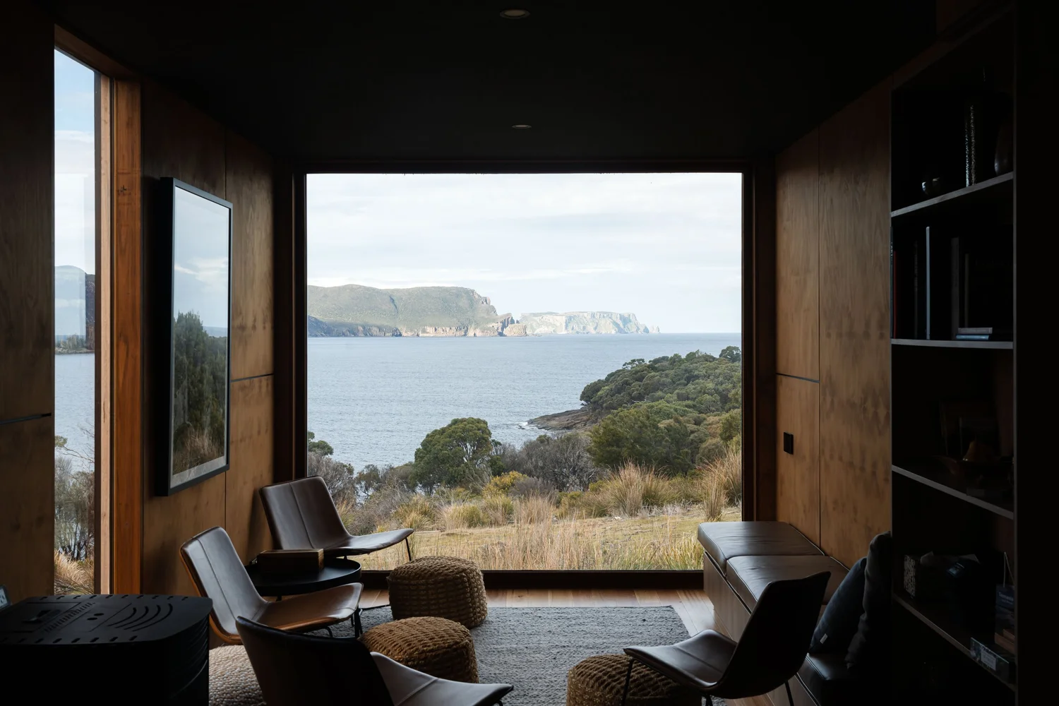 Off-grid Tasman Peninsula dwelling by Saxon Hall Architecture, clad in western red cedar on a coastal clifftop