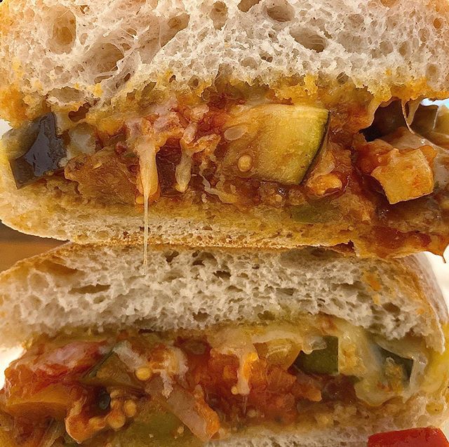 Chargrilled and Marinated Veg Sarnie

Our house marinade with beautiful aubergine, courgette, onions and peppers. With a rich tomato marinara served on ciabatta. Vegan. 
But you can add cheese (like I did) if you so choose....