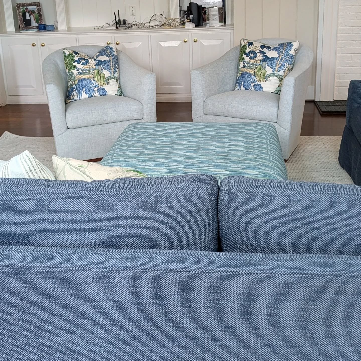 Sneak peek of a colorful den that is coming together 💙💙💙
.
.
.
#letsdecorate #winstonsaleminteriordesign #lovewhereyoulive #blueinteriors #customottoman #makeitcustom #livecolorfully #designerpillows #familyfriendlyinteriors
