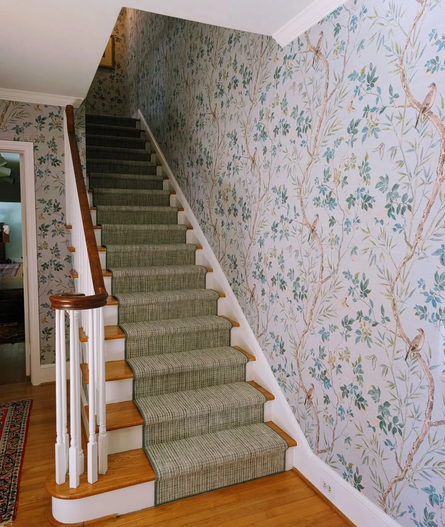 Although I did kind of like the stripes, we gave this entryway a big glow up with serene wallpaper and a beautiful green wool runner. 
.
.
.
#beforeandafter #lovewhereyoulive #entrywayglowup #entrywayinspo #wallpaperwednesday #makeanentrance #winston