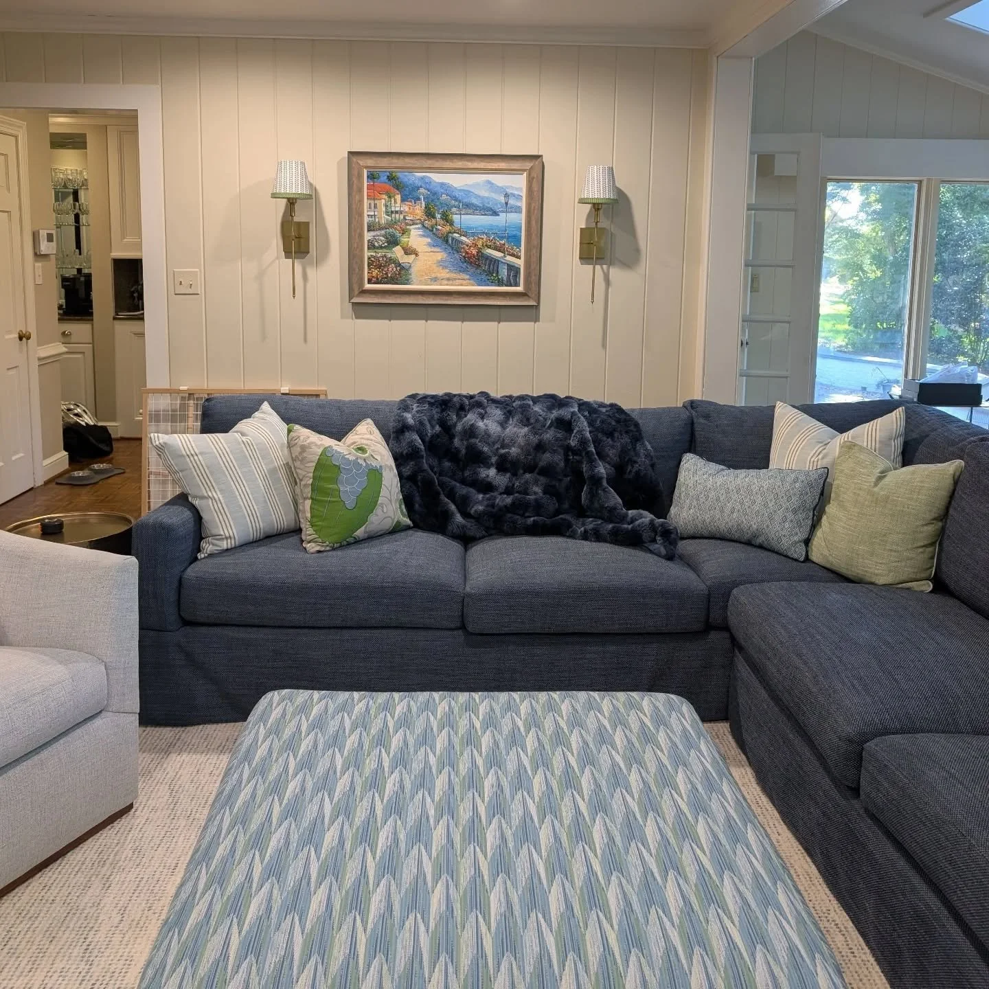 A colorful cozy den 🩵💙💚
We just put together the finishing touches, hung the art and styled the shelves 
.
.
.
#winstonsaleminteriordesign #letsdecorate #livewhereyoulive #blueinteriors #customlampshades #makeitcustom #pillowparty #dens