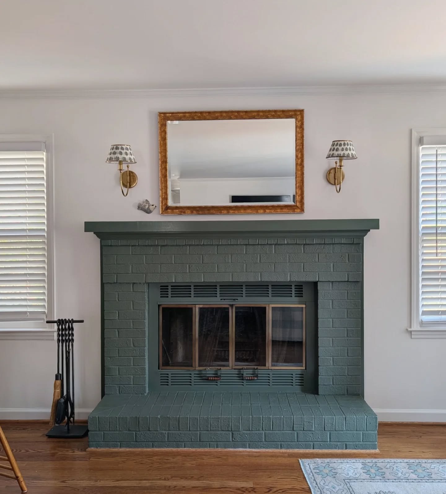 The power of paint ✨
.
This fireplace glow up made such a difference in the open living room, and the addition of sconces is always a good idea. 
.
Winston Salem interior design | fireplace remodel | before &amp; after | love where you live