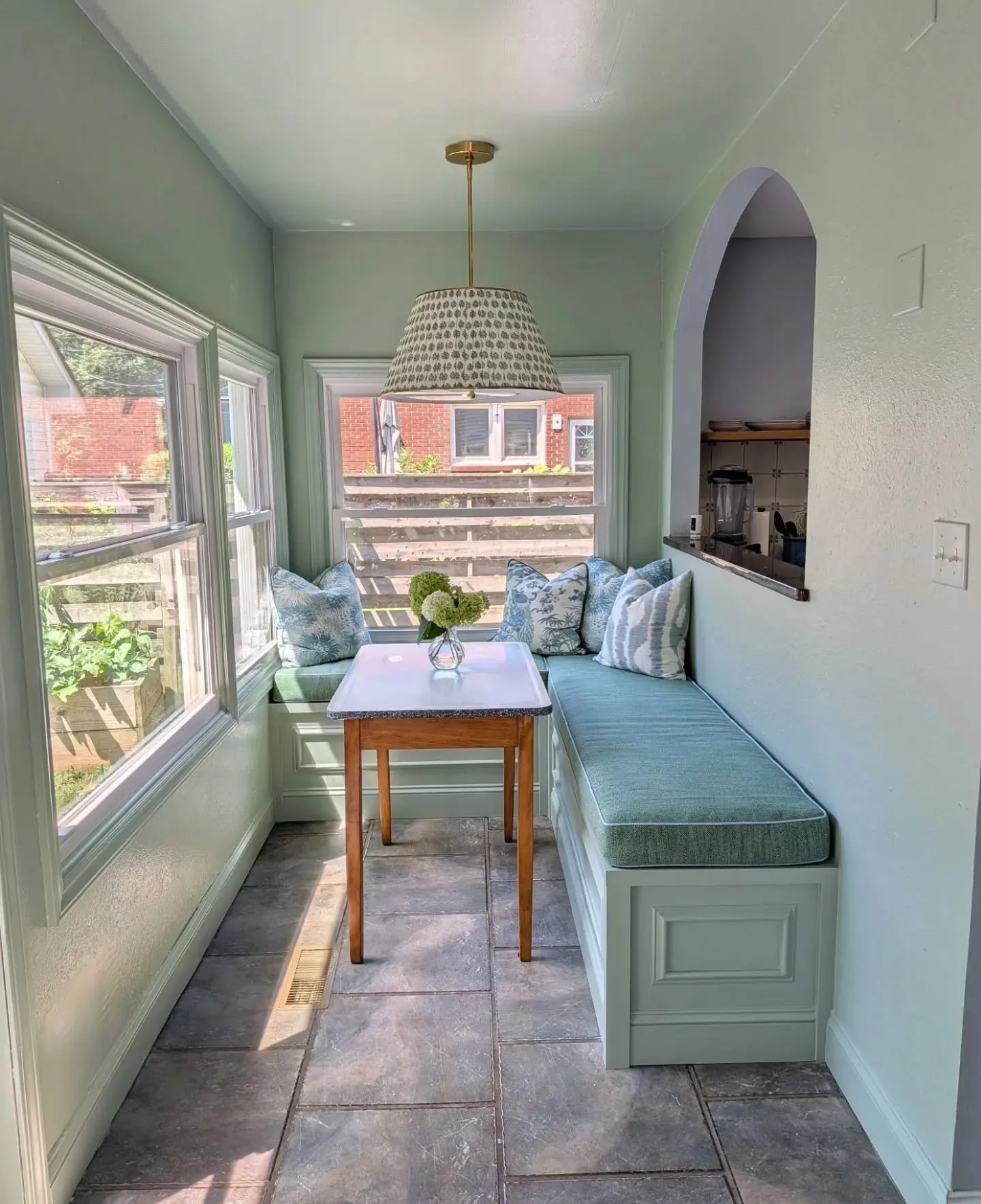 This sunroom transformation provided a beautiful space drenched in green with plenty of storage and practicality for a young family. Performance cushions and fun mix and match patterns keep it playful 💚
.
Built by @daretodesignnc who made something 