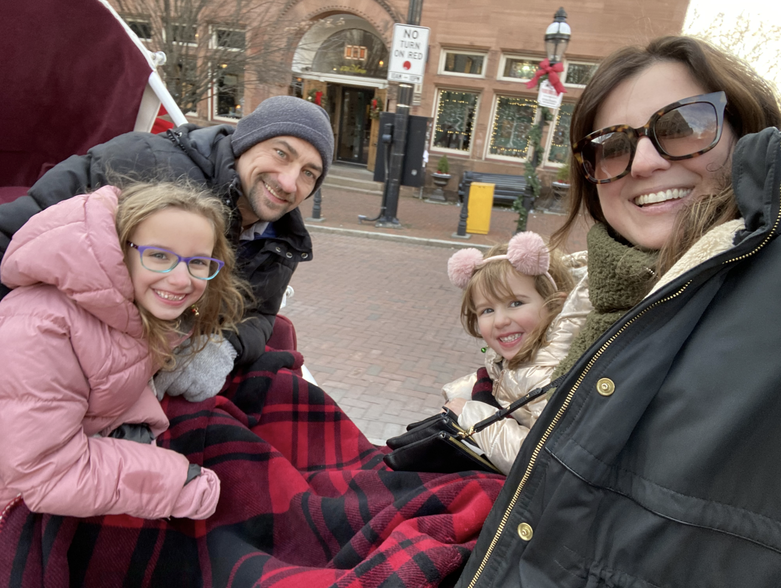  Ronnie and his family enjoying a horse and carriage ride through downtown Bethlehem around the holidays. 