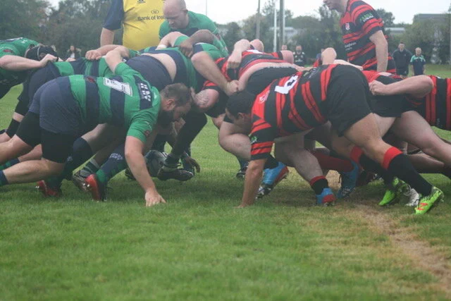 Clane RFC forwards driving in a scrum