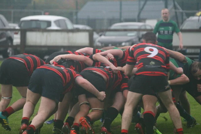 Clane RFC scrum with the number 9 ready behind it