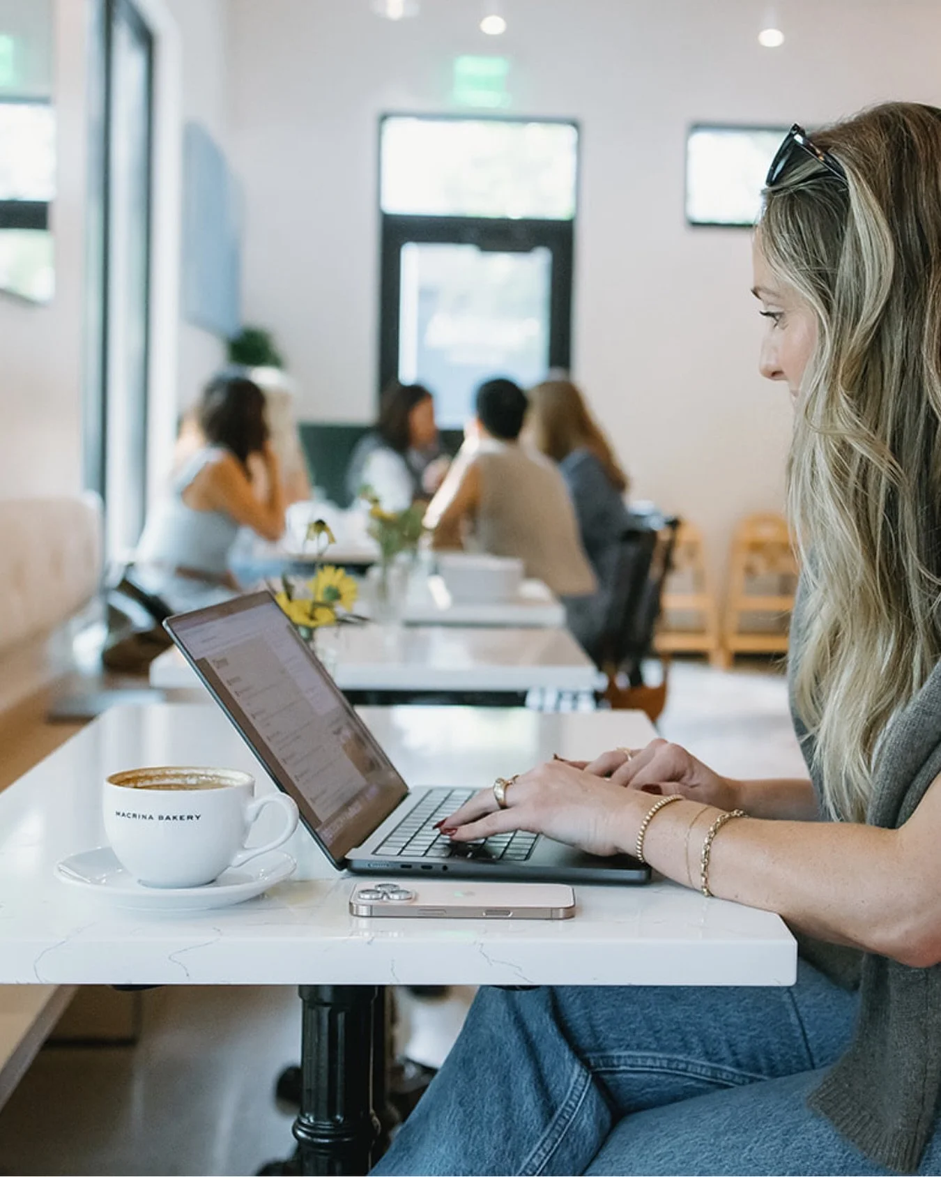 Don&rsquo;t be fooled by this quiet laptop moment&hellip;
There are group chats buzzing, tabs on tabs open, and a full team chiming in a few feet away. (The proof is in the back drop.)

Calm on the outside and team-powered behind the curtain. That&rs