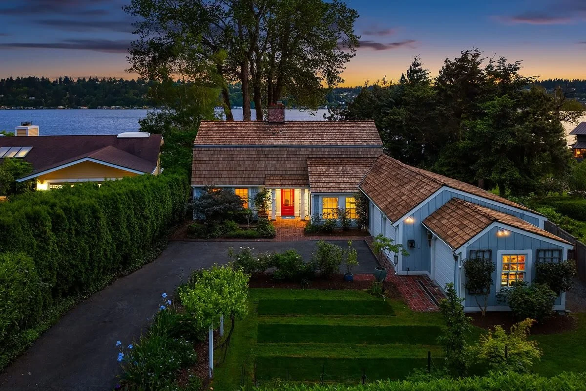 Tucked along the shores of Lake Washington, just moments from Kirkland, this waterfront home carries quiet confidence.
Set down a private drive on 59 feet of waterfront, this beautifully updated retreat blends timeless character with a more modern wa