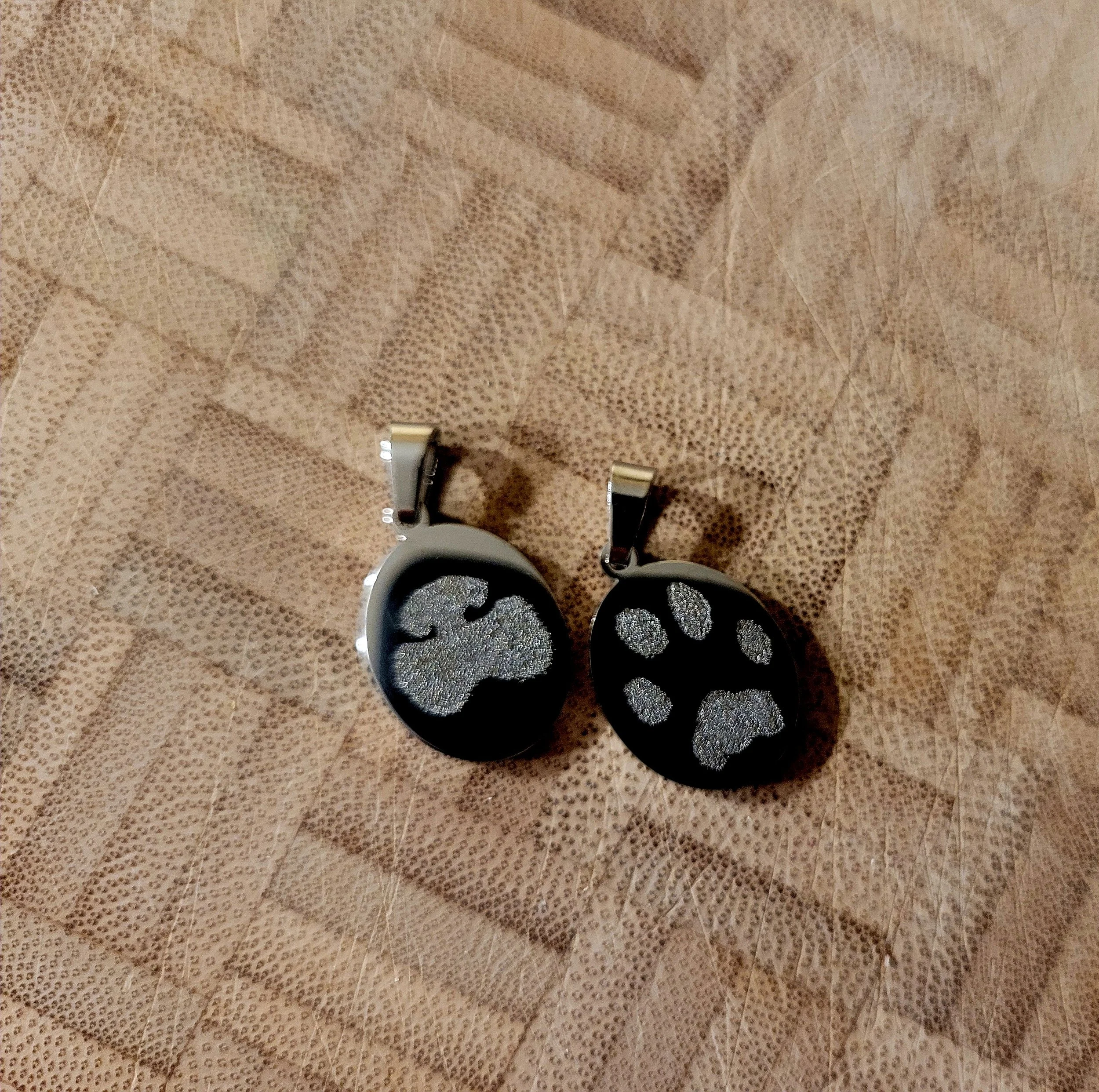 Porter's nose & paw print necklace charms.jpg