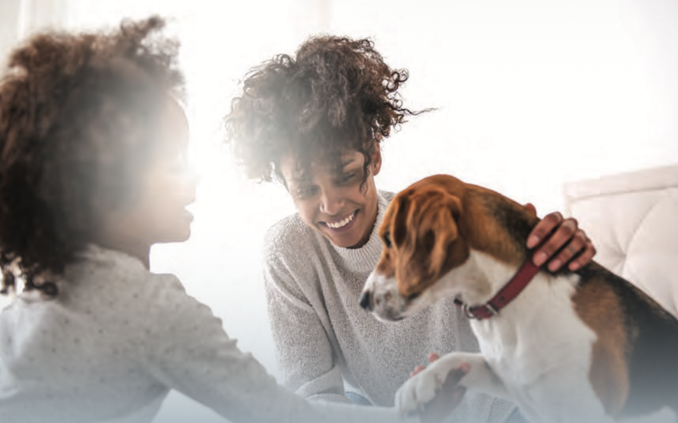 mother, child, and beagle dog representing the strong bonds and attachment children have with pets