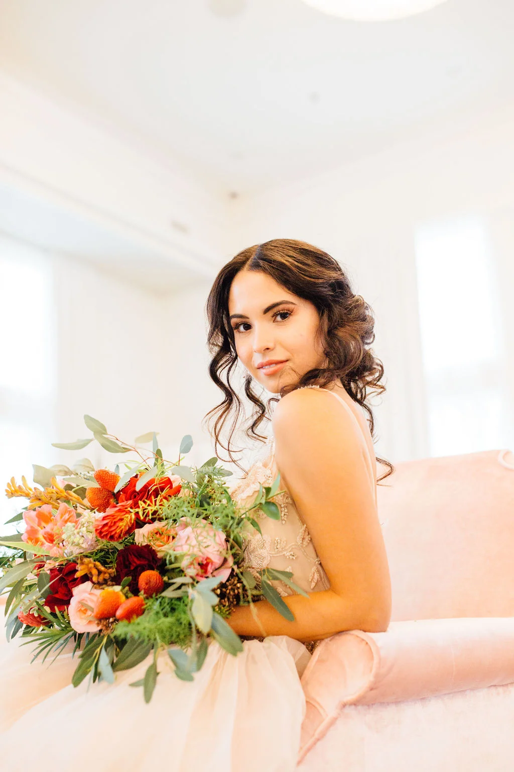 Wedding hair and makeup romantic updo with loose curls peachy makeup
