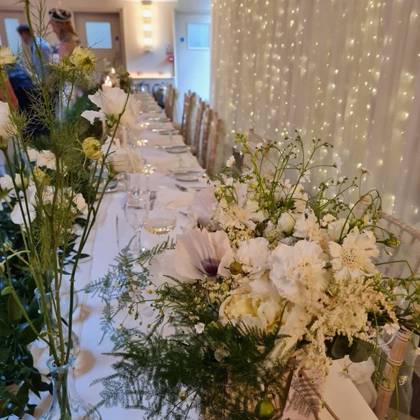 White and green top table flowers