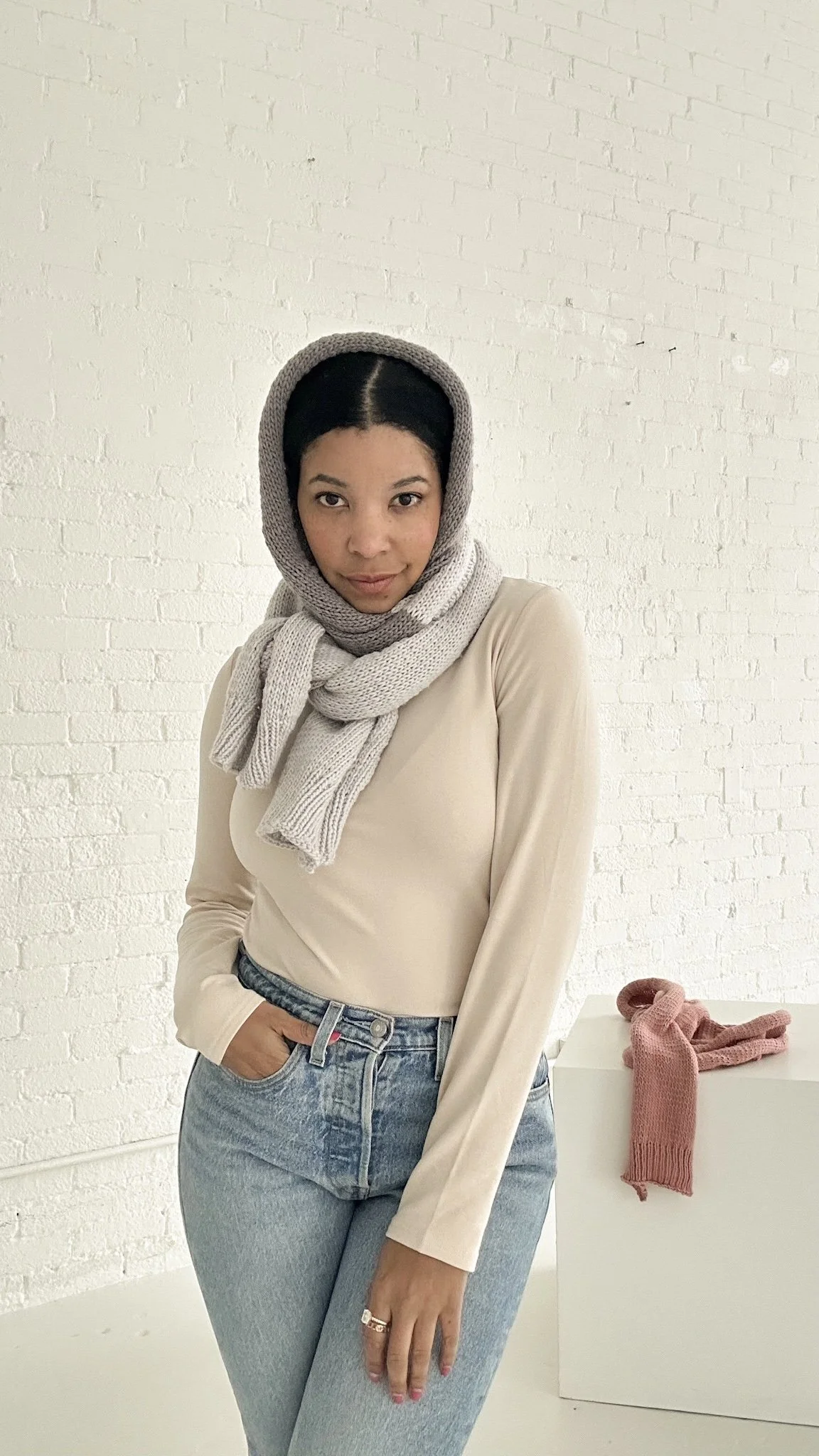 A modern knit scoodie pattern that blends a scarf and hood into one cozy essential