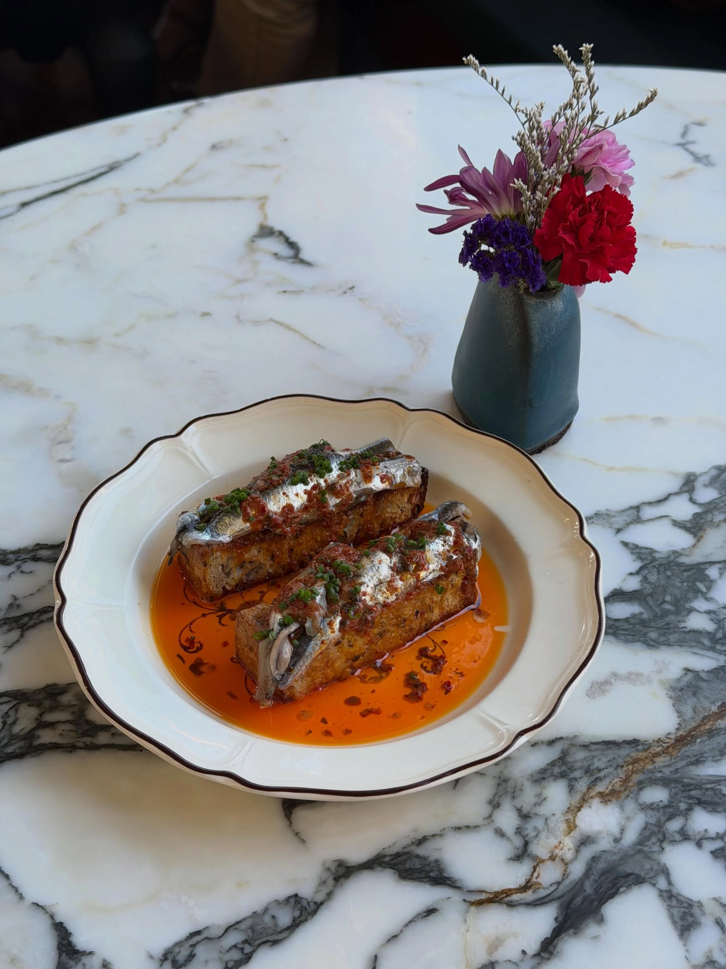 Anchovy toast, chili butter  Join us before we go on break next week. We will be back on July 9th, and so will the anchovies.