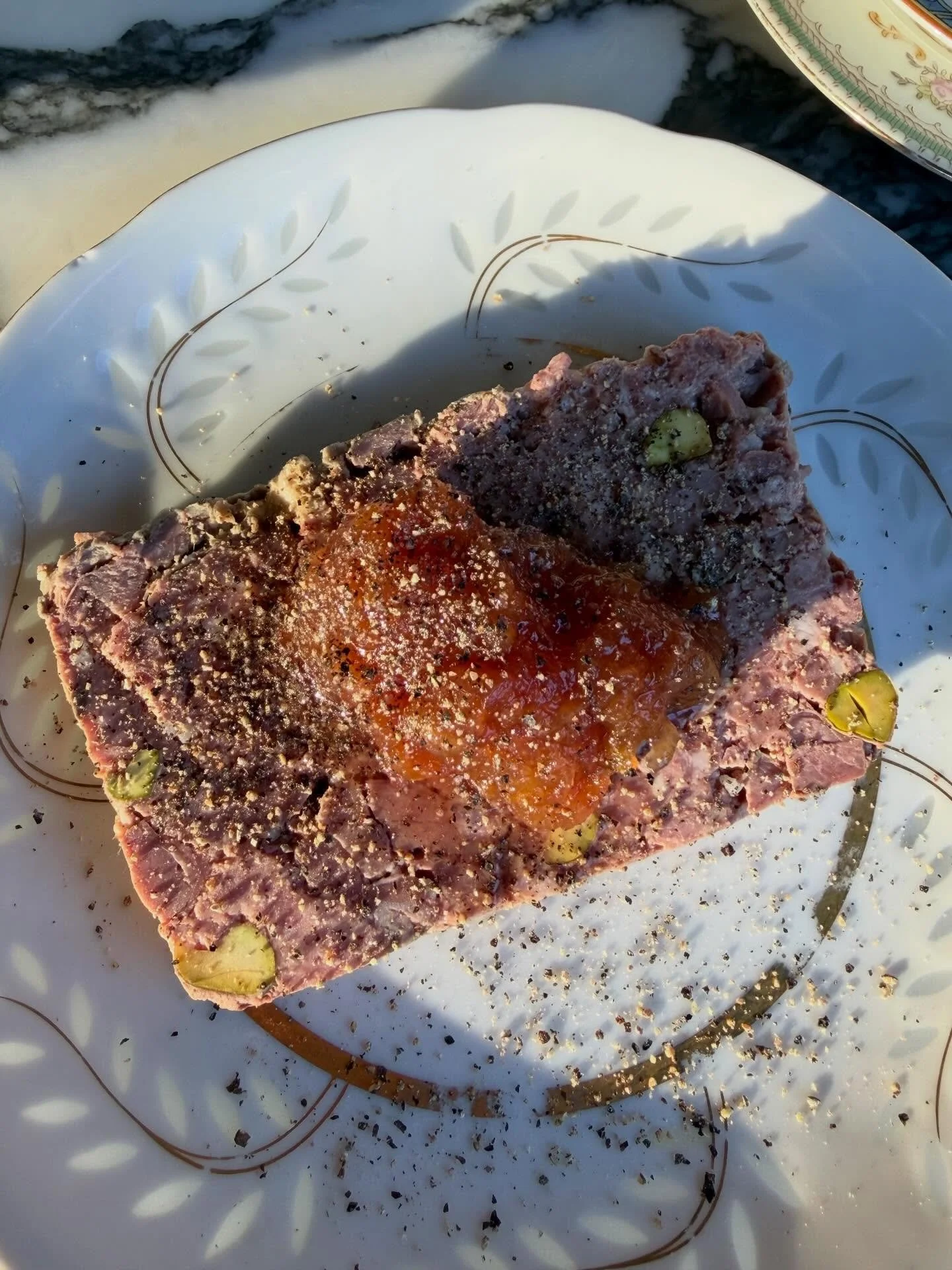 Duck and pistachio terrine, apple mustard, lots of pepper, moody lighting