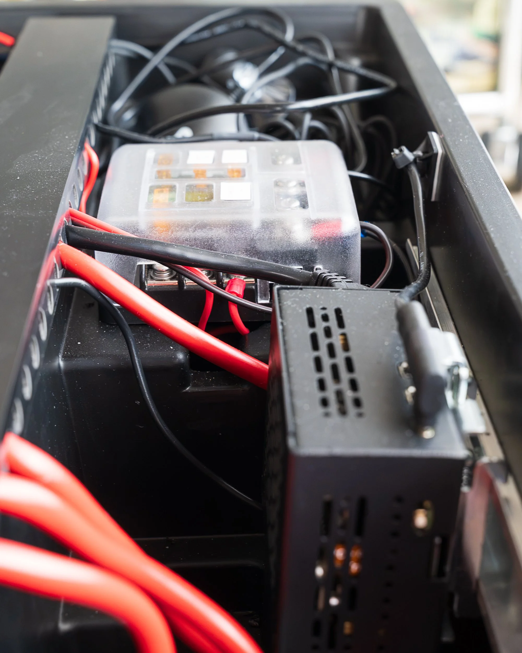 The fuse block — clean, individually protected distribution out to every circuit in the build.