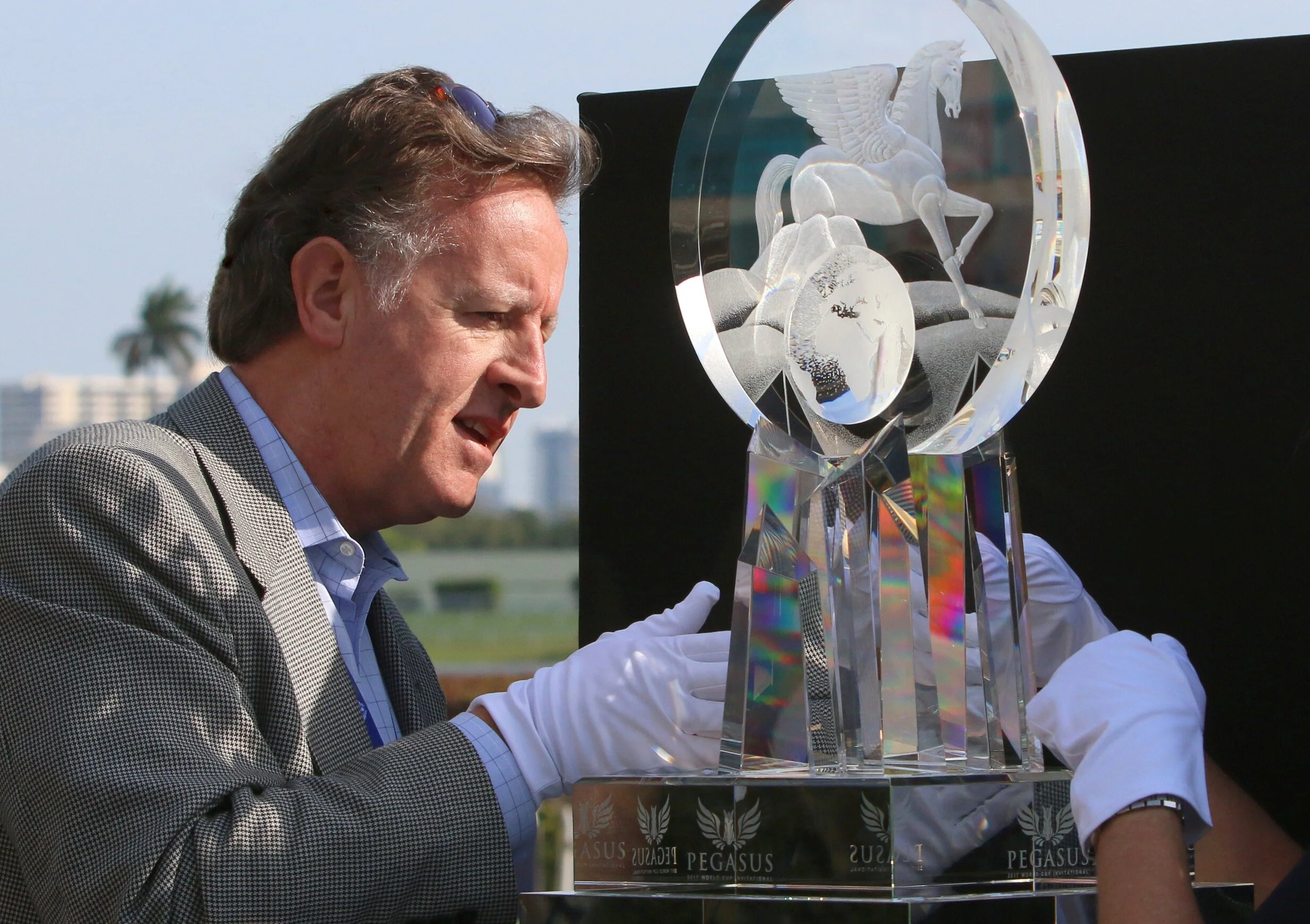 Mark Raynes Roberts, artist and designer of the Pegasus World Cup Invitational crystal trophy, puts the finishing touches to his trophy on race day morning at Gulfstream Park, Miami, Florida.