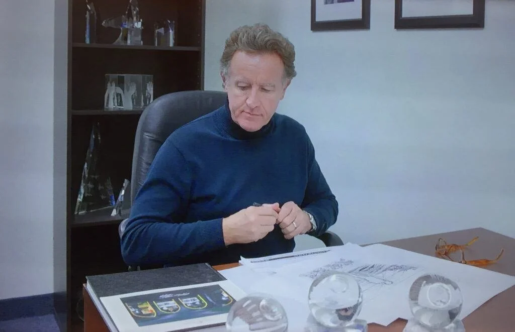 Crystal artist Mark Raynes Roberts, designing the WAR Flowers Crystal Collection in his studio.