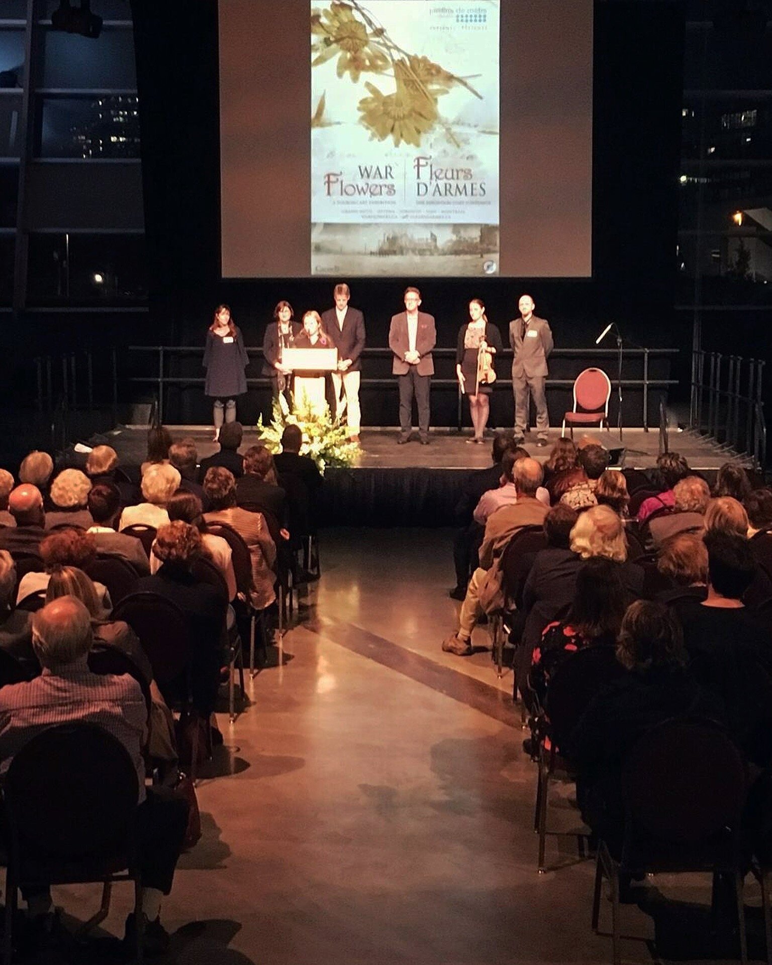 Curator, Viveka Melki, introduces the WAR FLOWERS creative team, (from left to right) Alexandra Bachand, (Perfumer) Celine Arsenault, (Conservator) Alexander Reford, (Historian) Mark Raynes Roberts, (Crystal Artist) and Normand Dumont. (Exhibition Designer)