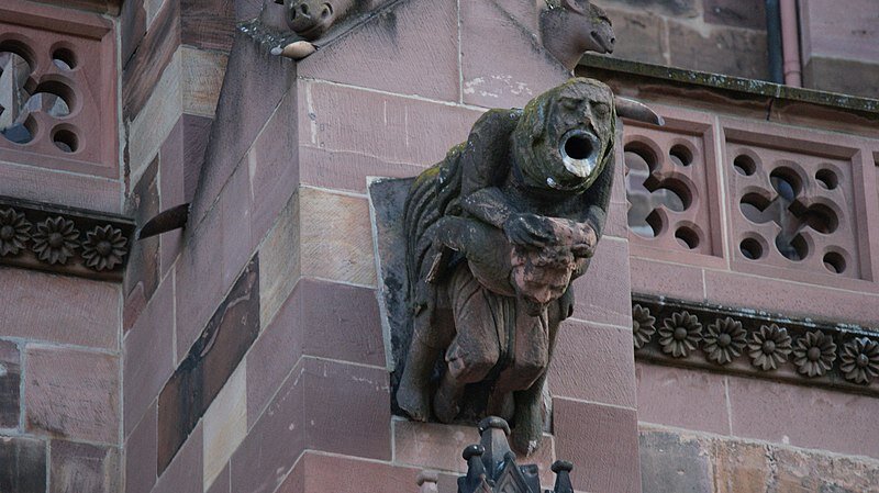  Exterior view and gargoyle of the Freiburg Minster, Freiburg im Breisgau in Germany. Men and mythical creature as a gargoyle by Asurnipal. This file is licensed under the  Creative Commons   Attribution-Share Alike 4.0 International  license.    