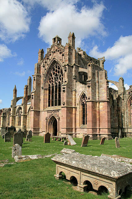  Melrose Abbey from the burial ground Founded in 1136, the abbey was always subject to sacking and rebuilding, and most of the surviving building is 15th century.     https://en.wikipedia.org/wiki/Melrose_Abbey#/media/File:Melrose_Abbey_from_the_buri