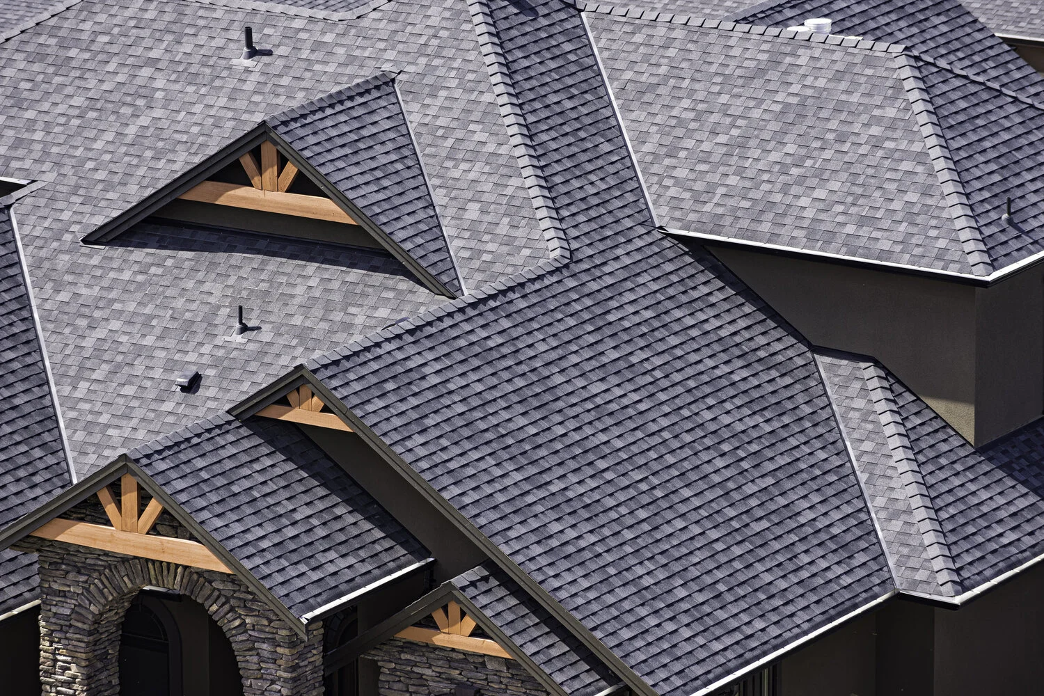 Rooftop-in-a-newly-constructed-subdivision-showing-asphalt-shingles-938323132_2125x1416.jpeg