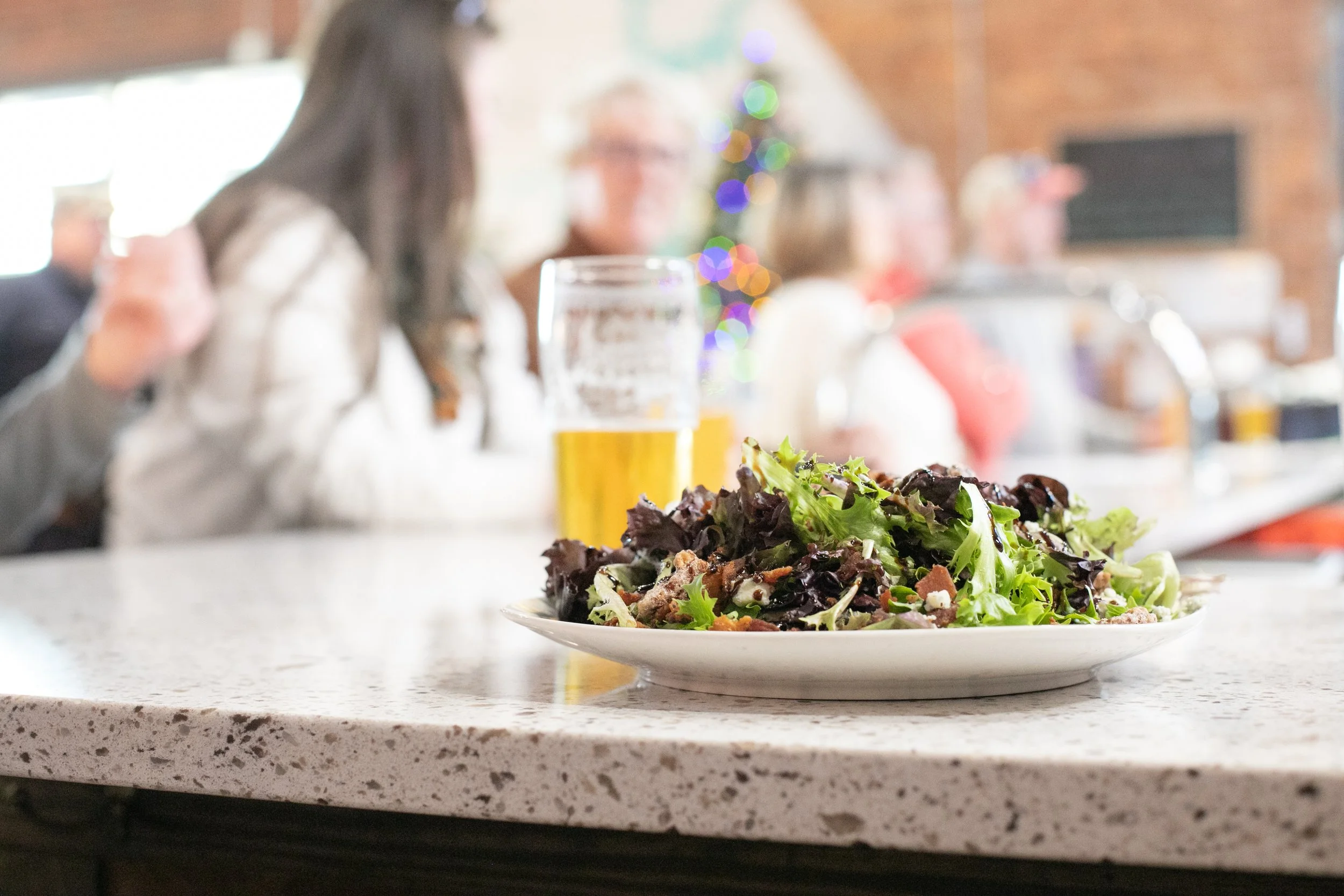 Fresh Green Salad with half drank pint of beer