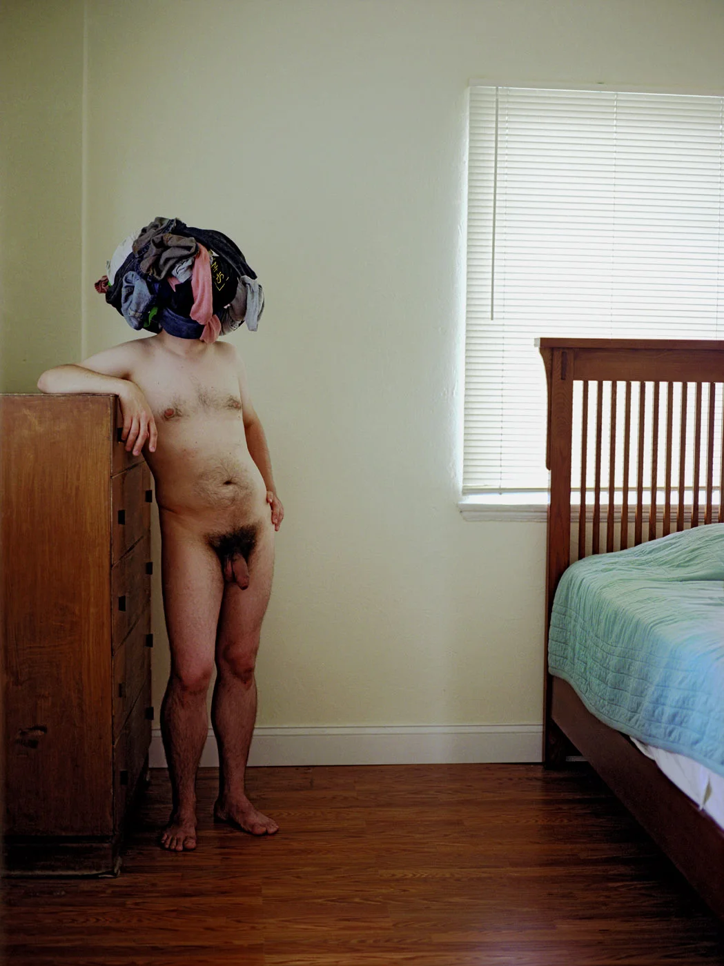 Untitled (Clothes on Head), 2007, c-print, 25” x 18”