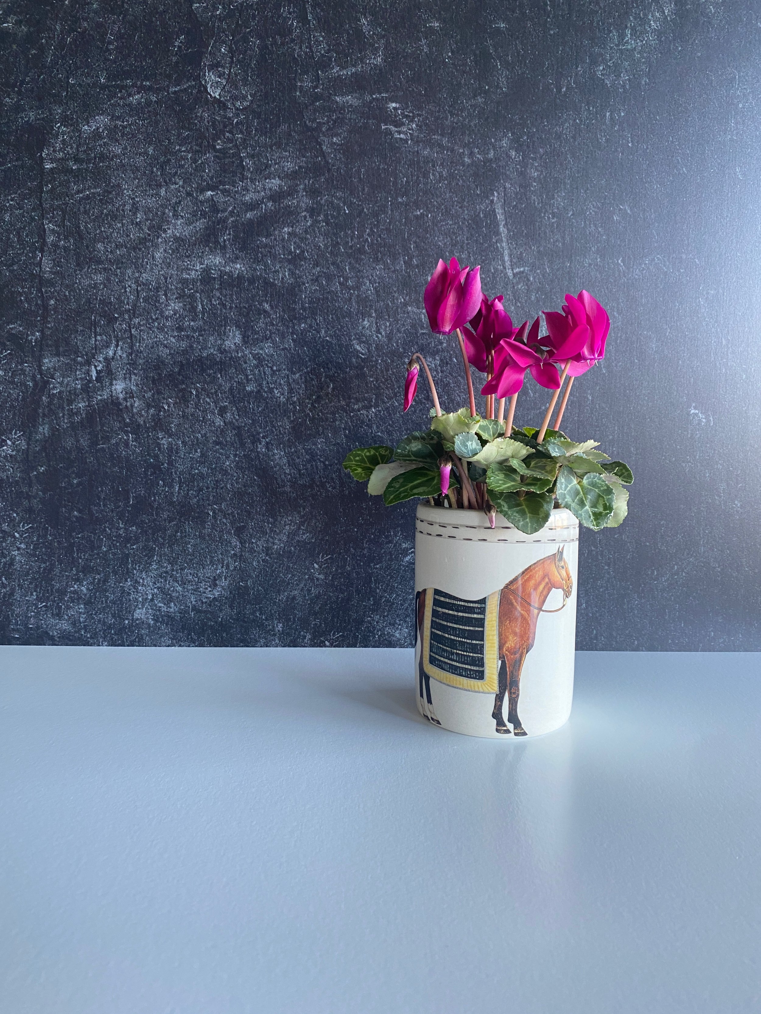 IMG_8834.jpegHand-painted Italian ceramic tumbler with black and gold striped horse blanket design with flowers