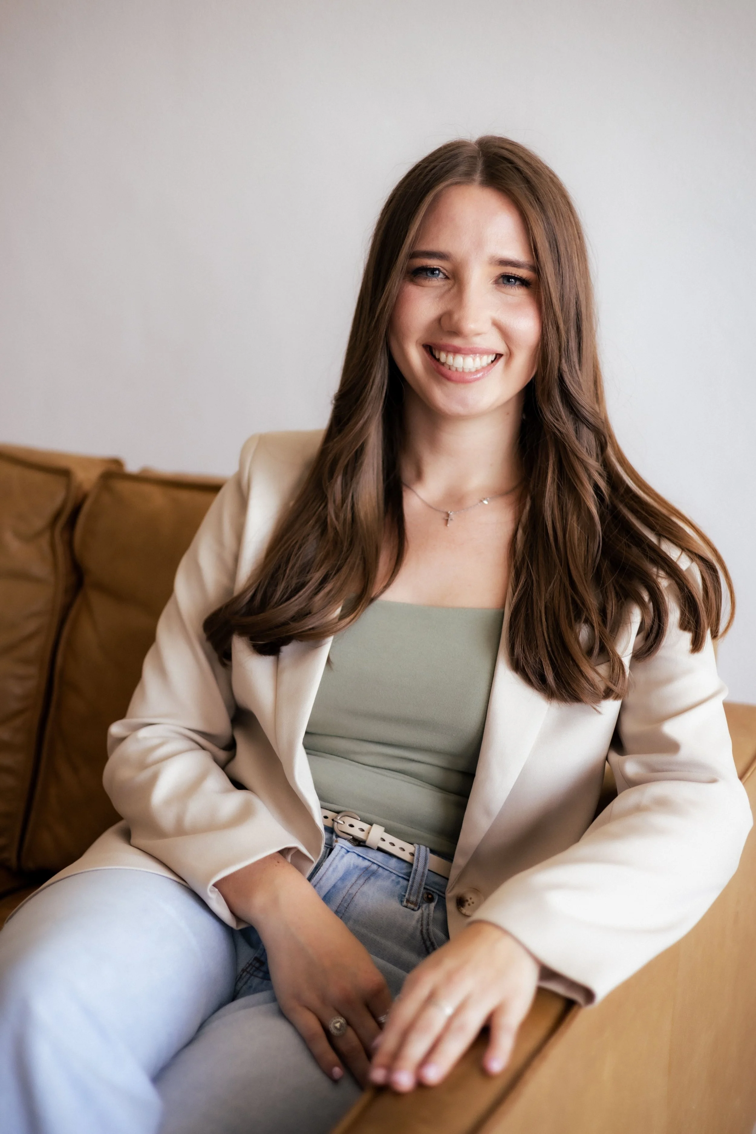 Counselor sitting on a couch counseling a client  in trauma counseling Dallas, guided by an accelerated resolution therapist near me. Contact us to find support from a PTSD therapist specializing in Accelerated Resolution Therapy ART.