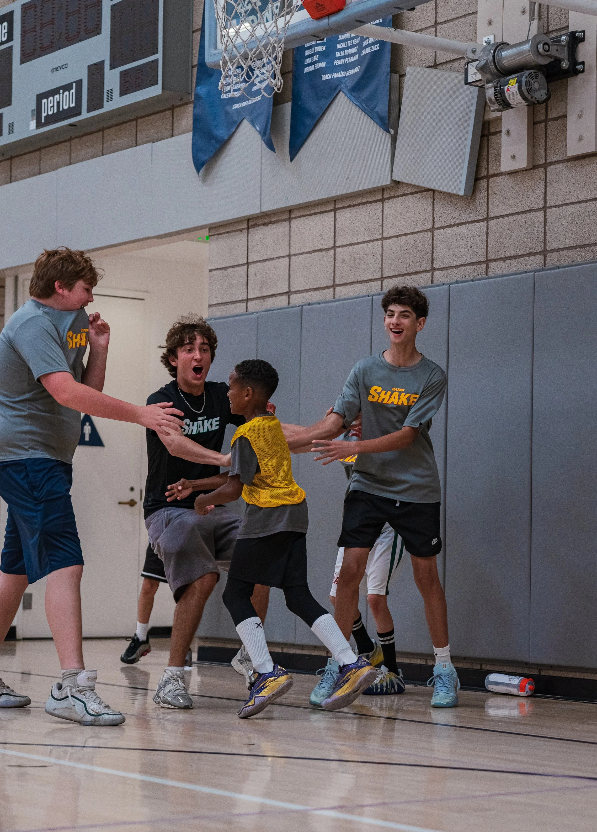 Camp SHAKE campers celebrating together in the gym