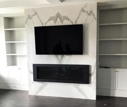 Fireplace with bookmatch tile slabs