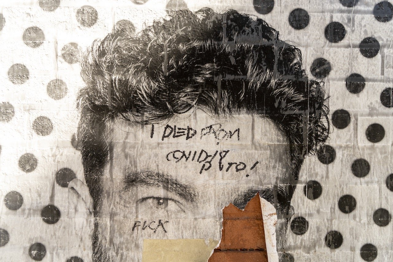 "I died from COVID-19 Puto," "Inside Out," detail. A 2021 Global Art Project by JR,, 1,200 portraits of people who walked by Porth Authority, a portrait of the community as the NYC "reopened." West 40th St, Porth Authority, April 29, 2022.