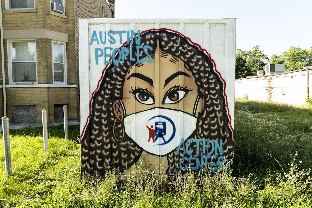 Masked face, Austin Peoples Action Center, 5139 West Lake St., Chicago, August 10, 2022.