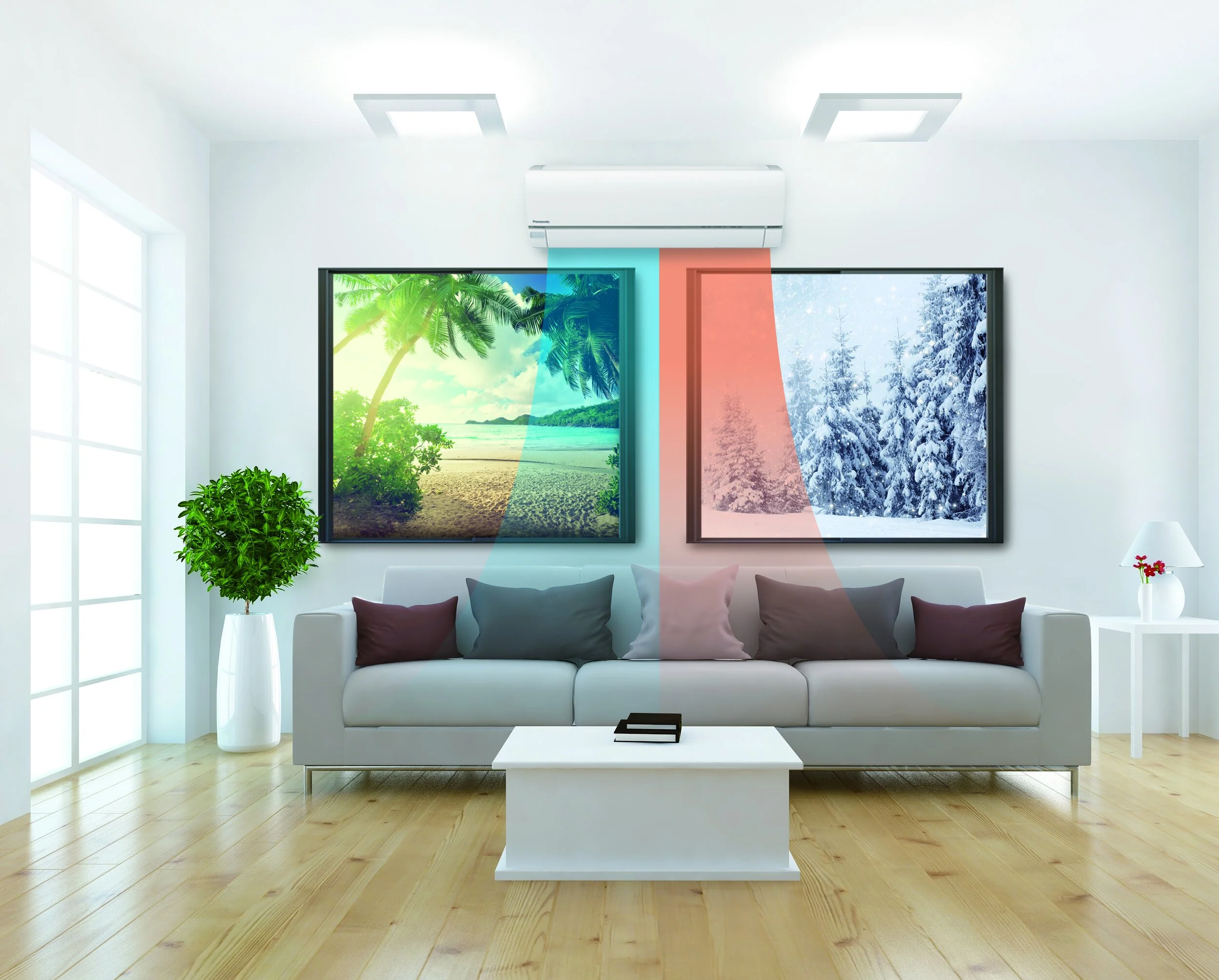 Living room with a white sofa, pillows, and a white coffee table, with two framed pictures above it showing a tropical beach and a winter snow-covered forest, a potted plant on the left, and a side table with a lamp and flowers on the right.