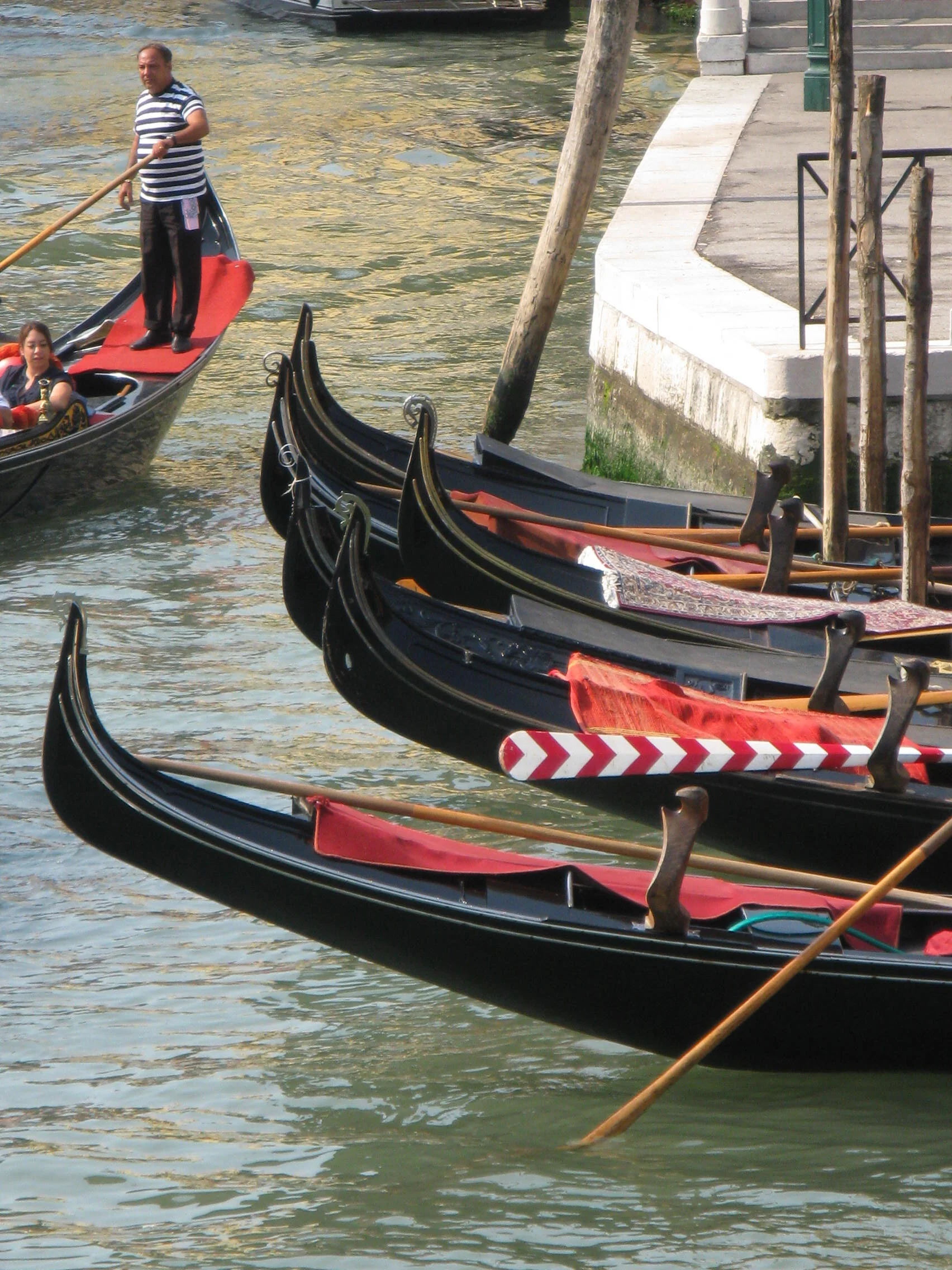 Traditional gondolas moored along a canal in Venice, Italy