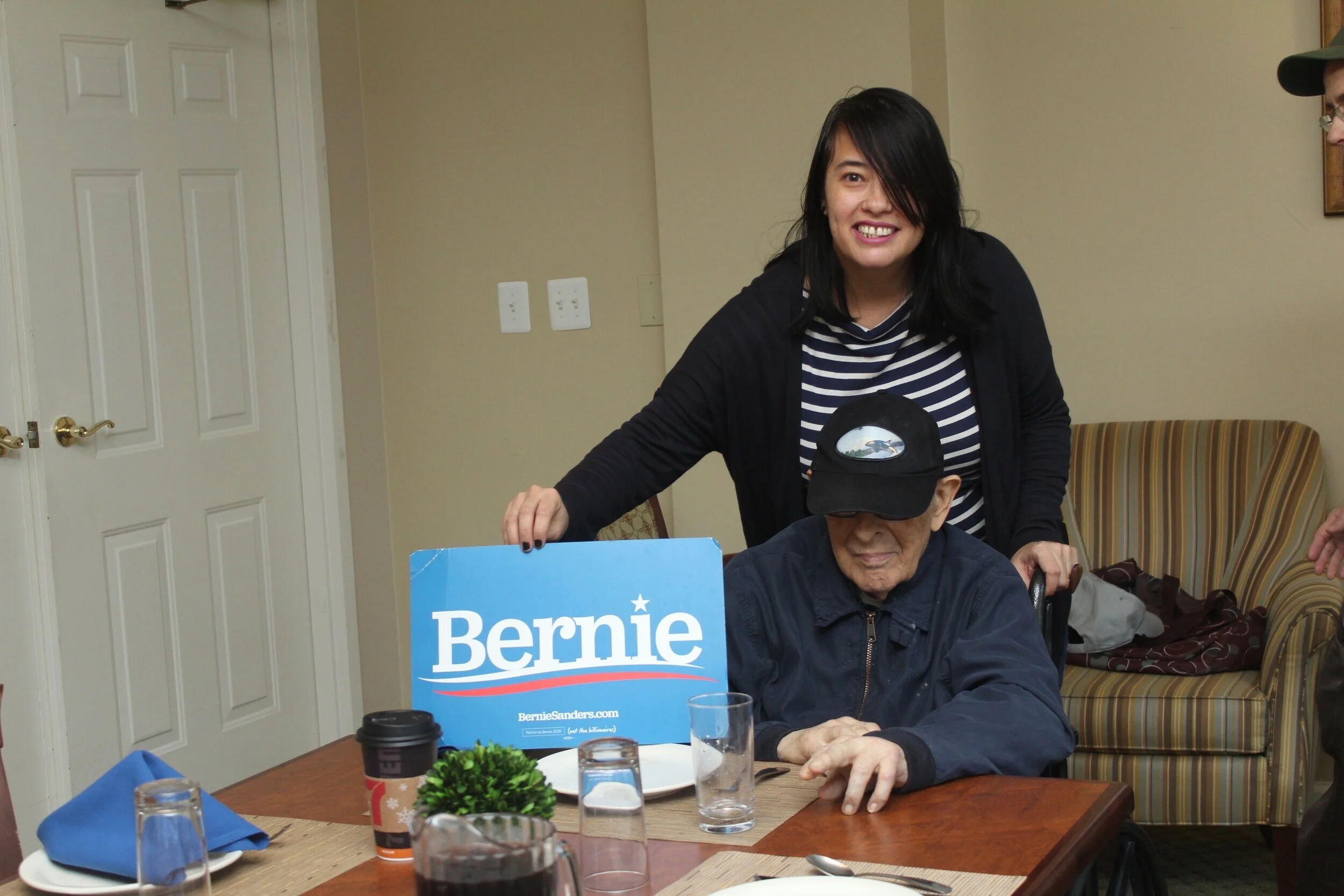 Kimberly holds her Bernie Sanders sign for Poppi on January 12