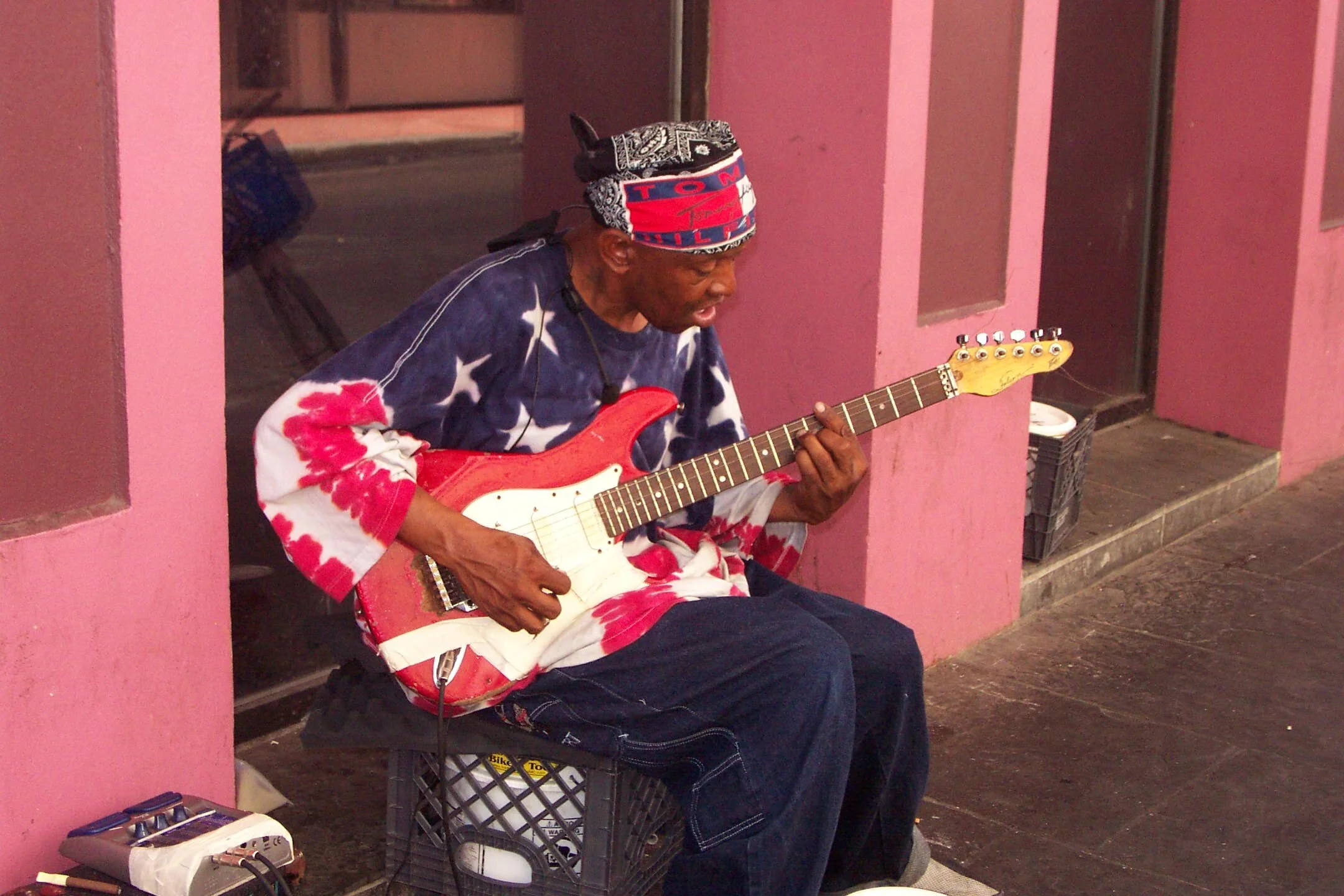 bourbon sgtreet playing guitatr.jpg