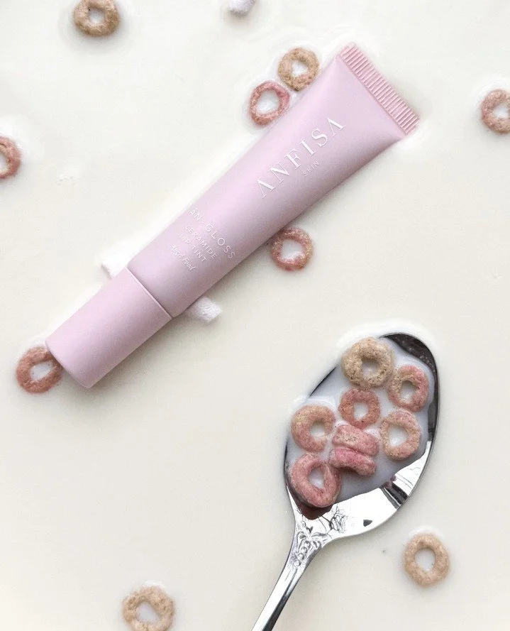 Delicious...in soooo many ways! 💋⁠
⁠
VERY limited stock now available for Anfisa's new "Angel Food" An-Gloss Ceramide Lip Treatment. Baby sheer pink with incredible skin benefits, and the most delicious smell you've ever smelt!⁠
⁠
IN STOCK