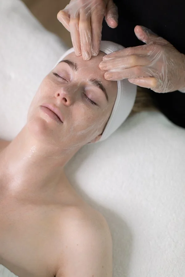 Esthetician performing a customized facial in Medford, Oregon