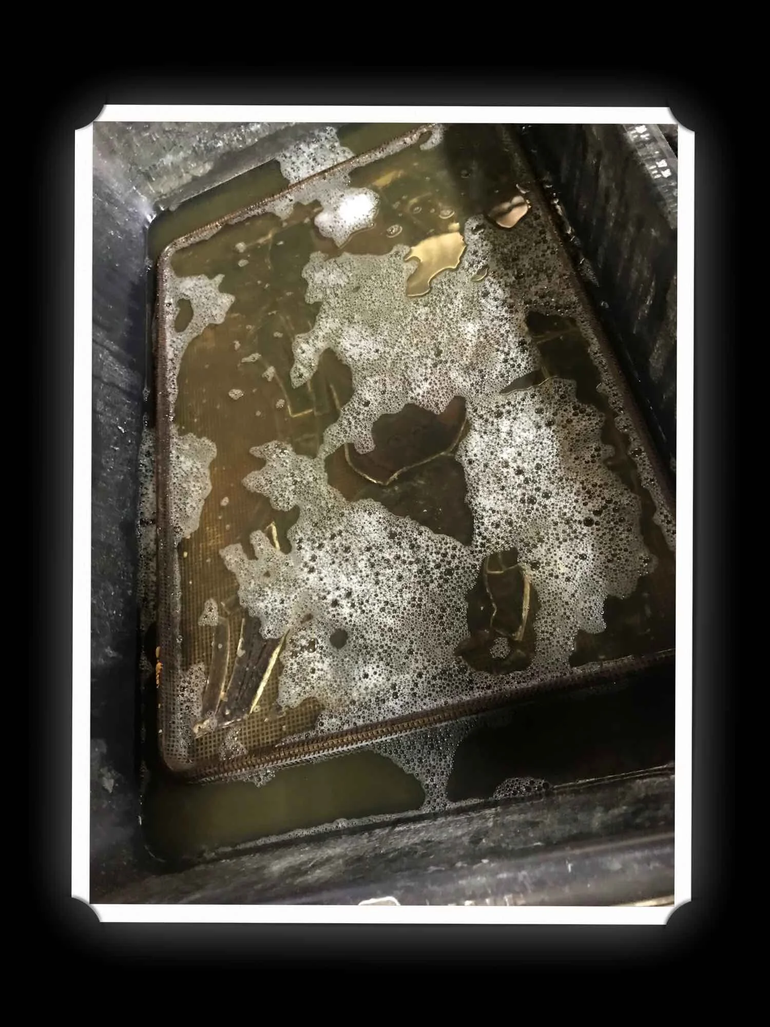 Step 7: All undamaged glass is gently placed in a special soak bath to loosen ancient cement and debris.
