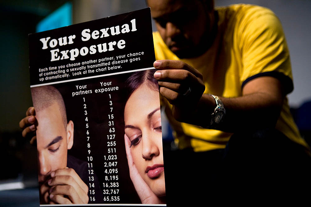  Anthony Gladden holds a sexual exposure chart during a fellowship at the Holywood Retreat at the Destiny World Church June 15 in Austell, GA. Young children, teenagers and their parents or guardians came together for three days to promote abstinence