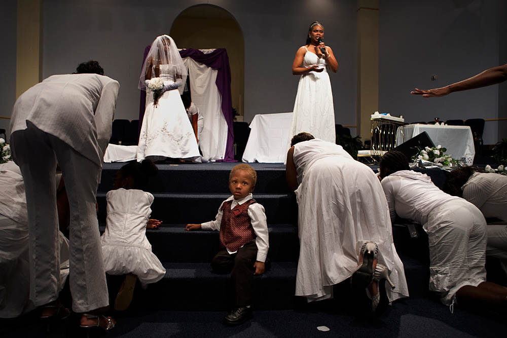  Congregants pray at the altar during the Purity Ring Ceremony at the Destiny World Church June 16 in Austell, GA. Young children, teenagers and their parents or guardians came together for three days to promote abstinence. Issues like STDs, peer pre