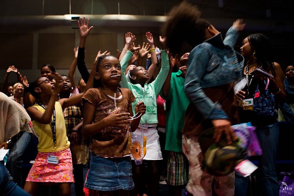  Young girls jump for gifts and goodie bags at the Destiny World Church June 15 in Austell, GA. Young children, teenagers and their parents or guardians came together for three days to promote abstinence. Issues like STDs, peer pressure, teen pregnan