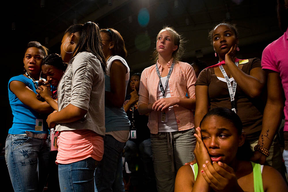  Tanyetta Hampton, 17, is comforted by friends during a Christian concert at the Destiny World Church June 14 in Austell, GA. Young children, teenagers and their parents or guardians came together for three days to promote abstinence. Issues like STD