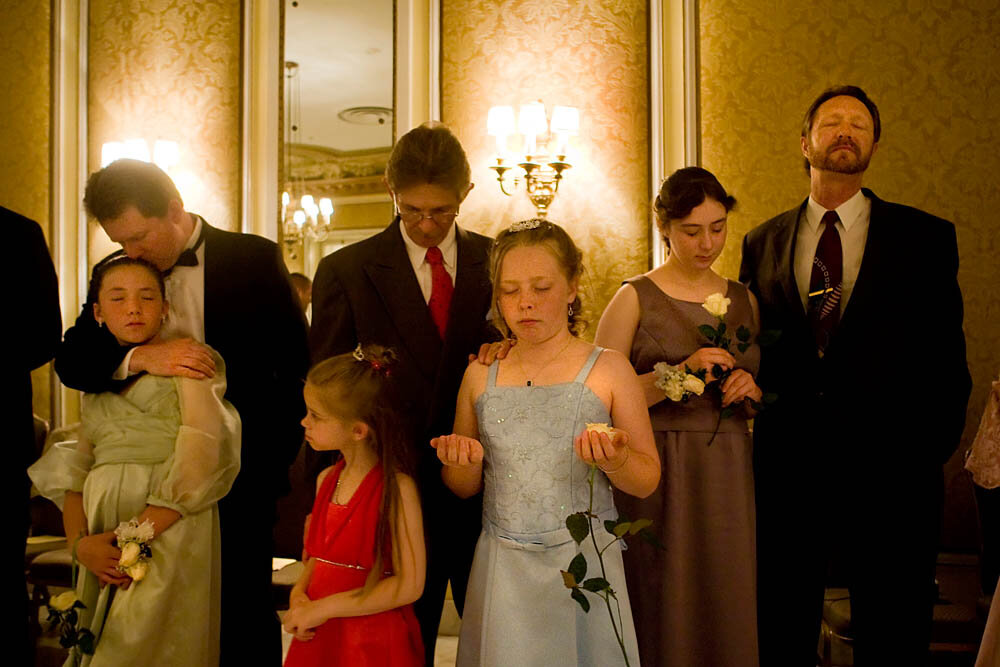  Fathers and daughters pray together in the ballroom of the Broadmoor Hotel on May 16, 2008 in Colorado Springs, CO. The annual Father-Daughter Purity Ball, founded in 1998 by Randy and Lisa Wilson, focuses on the idea that a trustworthy and nurturin