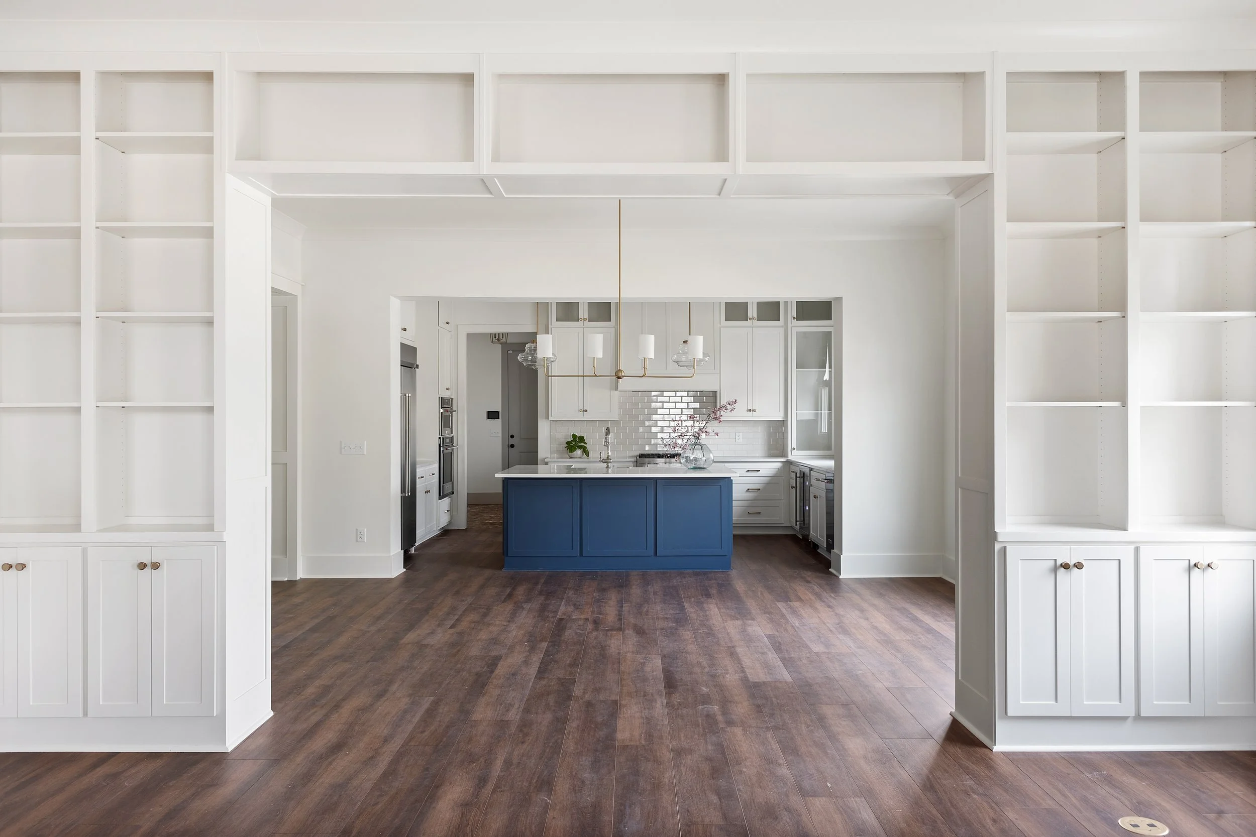 Open living space renovation with blue kitchen island in Columbus Georgia