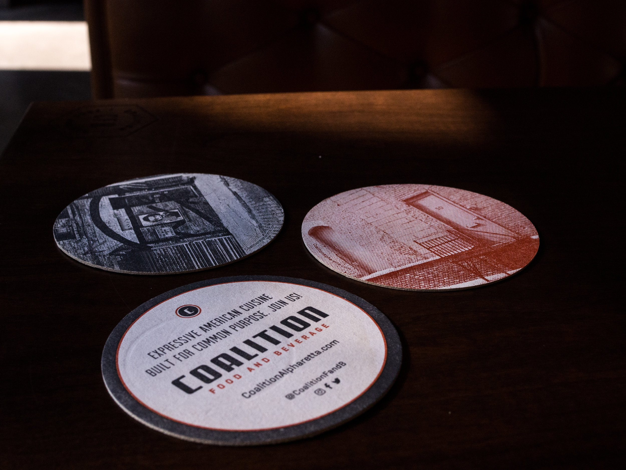 Coalition Food and Beverage Coasters on Table