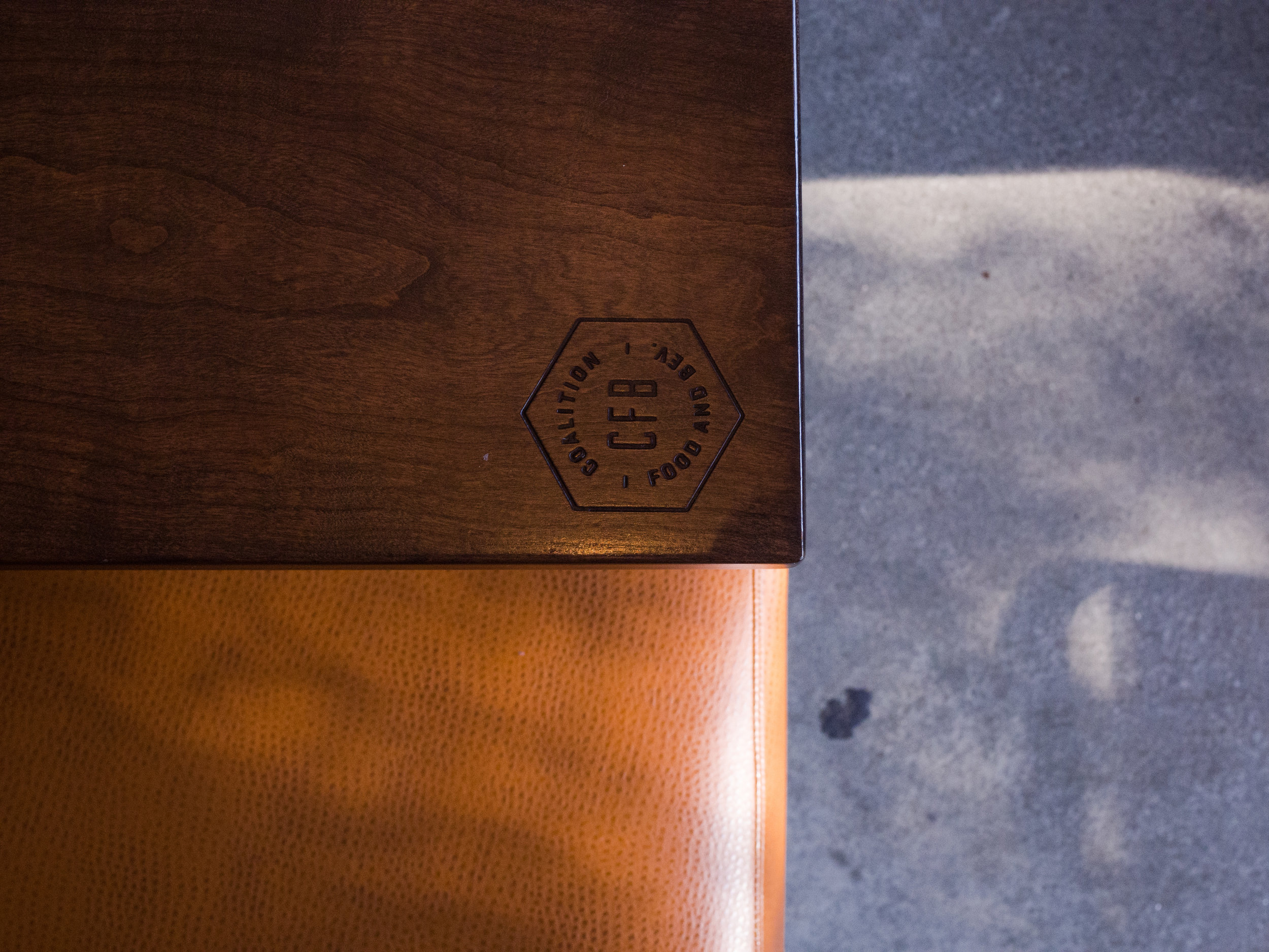 Coalition Food and Beverage Interior table with logo stamp